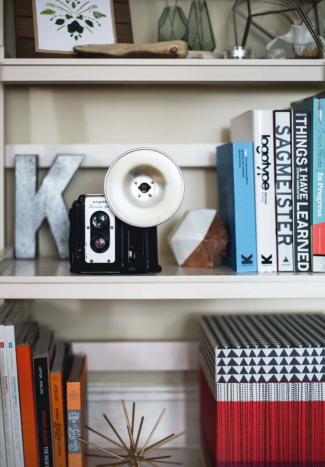 Bookshelf with box and camera